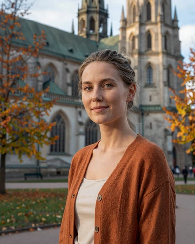Saga, 33, a dark blonde Swedish woman near Uppsala Cathedral in a warm autumn cardigan