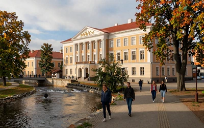 Tartu university town along Emajõgi river with colorful buildings and autumn foliage