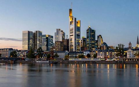 Frankfurt skyline at twilight with modern skyscrapers reflecting in the Main River