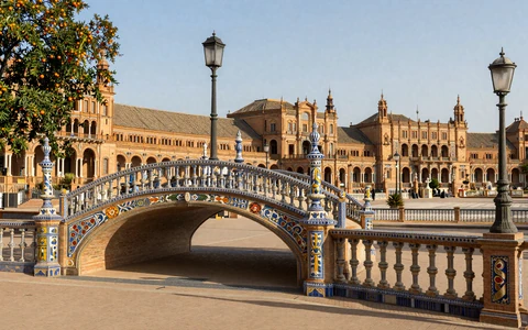 Seville Plaza de Espana with ornate bridge and ceramic tiles
