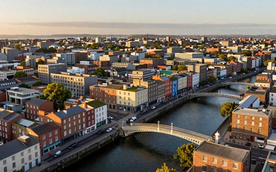 Dublin city center with the Ha'penny Bridge over the River Liffey at sunset