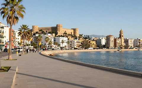 Málaga coastal promenade with Mediterranean sea and Alcazaba fortress