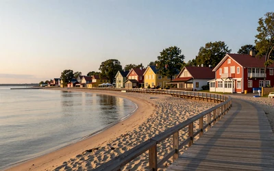 Pärnu beach town with sandy Baltic coastline and wooden boardwalk at sunset