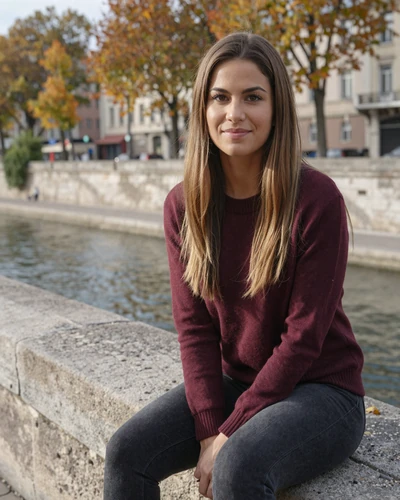 Éloise, 32, French woman from Lyon in a burgundy sweater by the riverside seeking meaningful connection