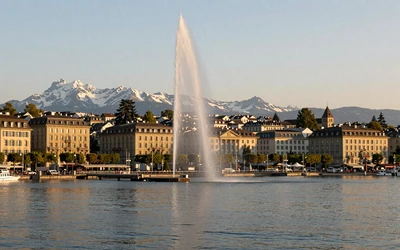 Geneva waterfront with Jet d'Eau fountain and Mont Blanc in the background
