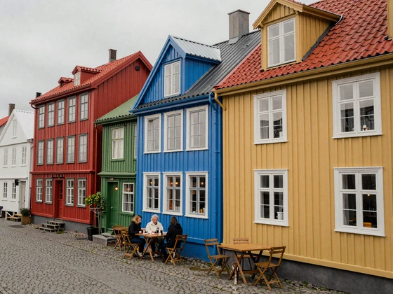Colorful traditional houses lining a charming Reykjavik street with cozy cafes
